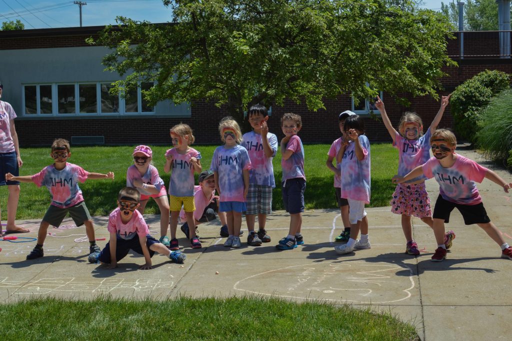 students wearing tie-dyed IHM shirts on field day